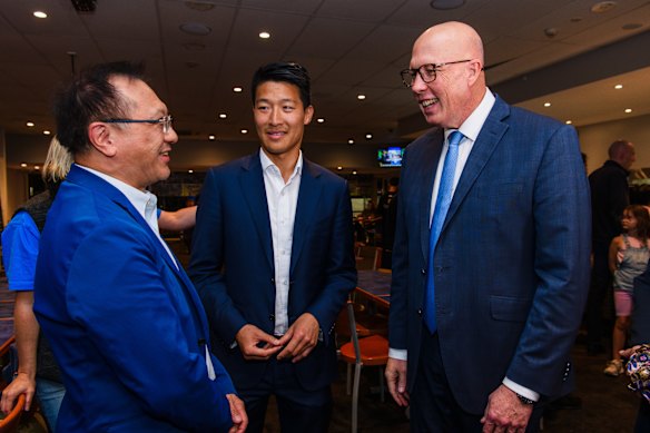 Scott Yung (centre) and Opposition Leader Peter Dutton at Gladesville Sporties during the campaign.