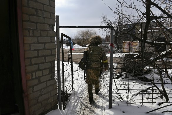 A Ukrainian soldier, Tanya, who does not want to be identified, walks back to her barracks  at Avdiyivka. 