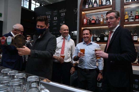 NSW Premier Dominic Perrottet (right) with NSW Deputy Premier Paul Toole (second from right) and NSW Treasurer Matt Kean (third from right) at Watson’s pub in Moore Park today.