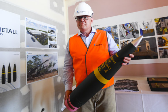 Lacking firepower? Australian Prime Minister Scott Morrison with a shell at an ammunition factory in Maryborough, Queensland, this month.
