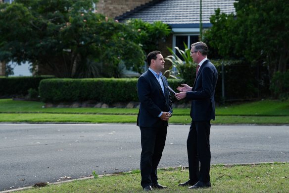 NSW Premier Dominic Perrottet (right) speaks with Stuart Ayres at a media event on Monday.