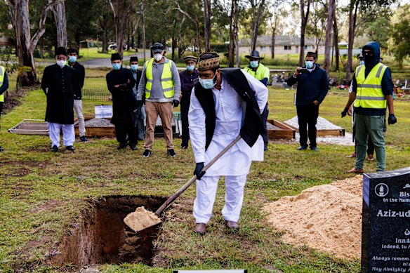 Ayaz Younus’s father Muhammad was allowed to briefly exit the car to cover his son’s coffin. 