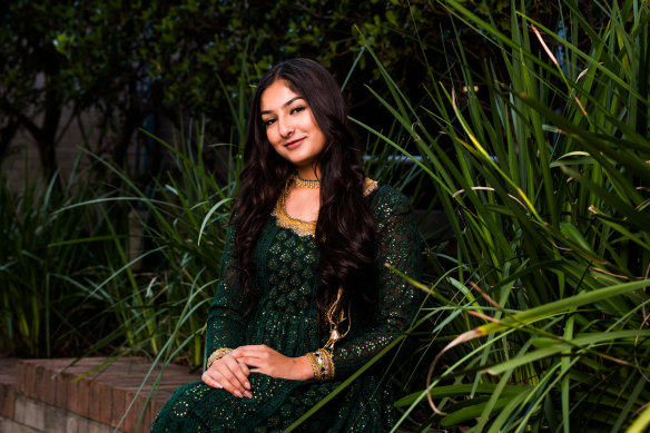Student Neha Khawaja, pictured wearing an Anarkali suit, is part of the school’s Bollywood club. 