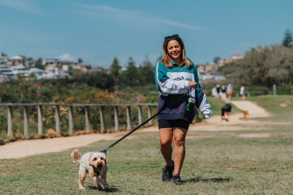 Natasha Jiwani with dog Rummy on Sydney’s northern beaches. She says “there’s a lot of stigma associated with IBD and gut health”.