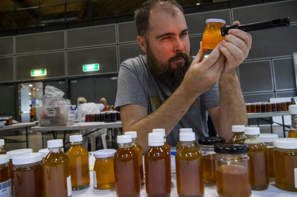 Dr Tobias Smith judging native honey at the Sydney Royal Easter Show in 2019.