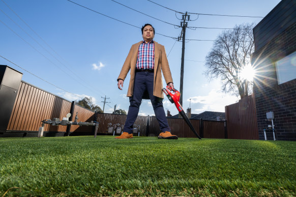 Fadh Yusof is fighting an order from the council to rip up his fake grass.