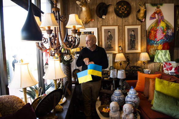 Rotate Interiors owner Greg Davies is among Oberon shop owners displaying Ukrainian flags in their windows.