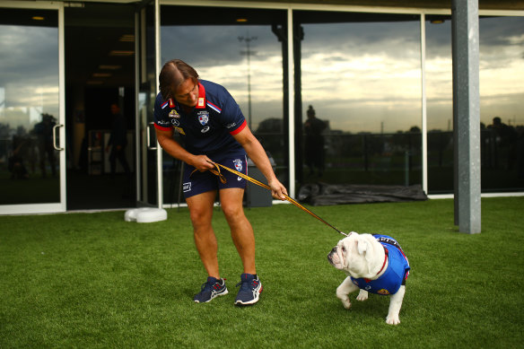 Coach Luke Beveridge with club mascot Caesar. The Western Bulldogs are confident they can weather the financial hit of this disrupted season.