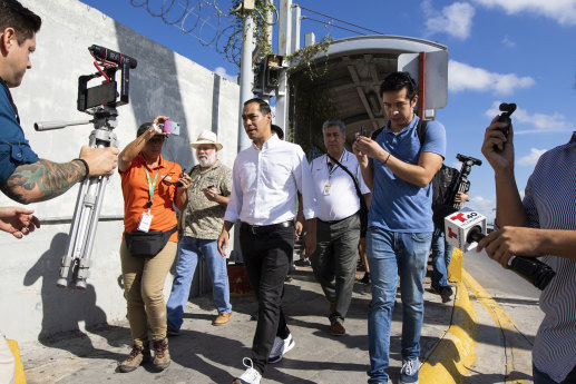 Democratic presidential candidate Julian Castro walks over the Gateway International Bridge on October 7 on a visit to the migrant campsite in Matamoros, Mexico.