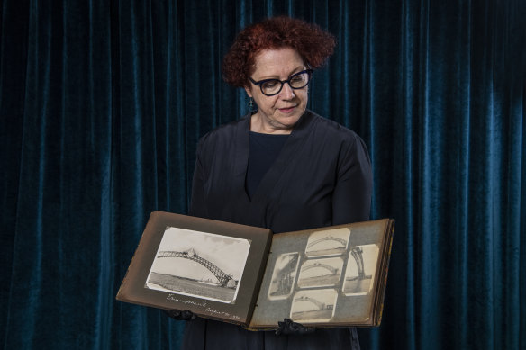 State Library curator Margot Riley holds the rare album.