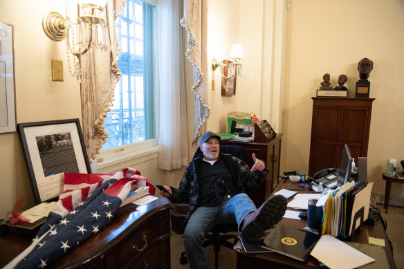 Trump supporter Richard Barnett made himself quite at home at Nancy Pelosi's desk.