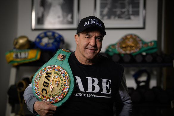 Jeff Fenech at home in Sydney with one of his belts.