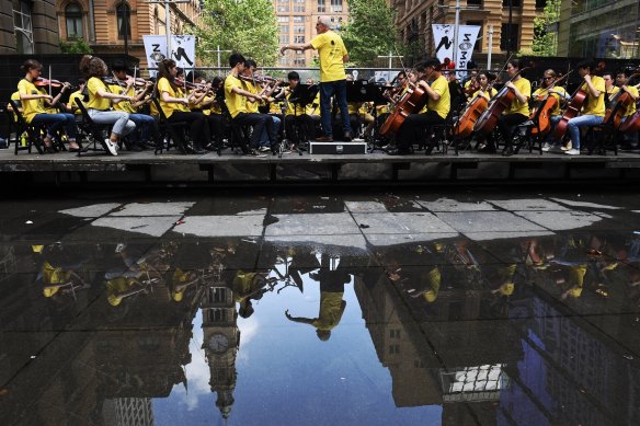 Happier times: The Sydney Youth Orchestra performs in Martin Place in 2018.