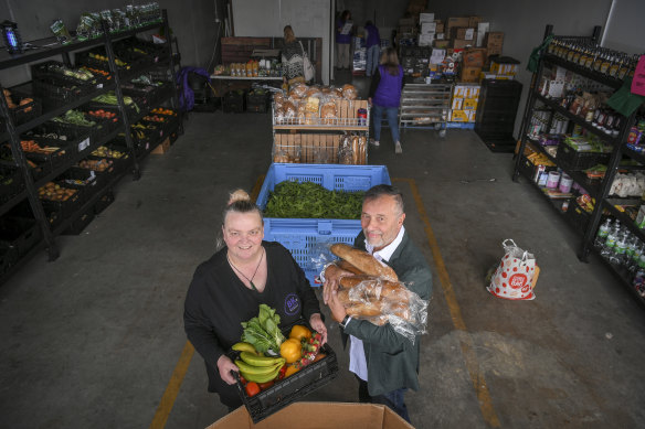 Room to move: Kelly Warren and Joe Calleja in the warehouse, which is much bigger than Ms Warren's car port.