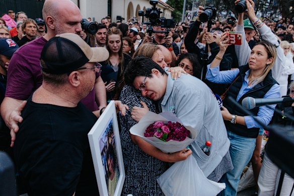 Parents of 10-year-old Matilda, who was killed on Sunday, attend the Bondi Pavilion vigil on Tuesday evening