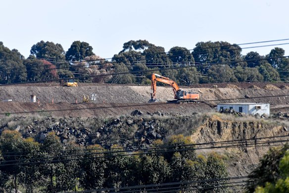 Remediation works at the site on Wednesday, the day the community found out the fires would burn well into 2022.