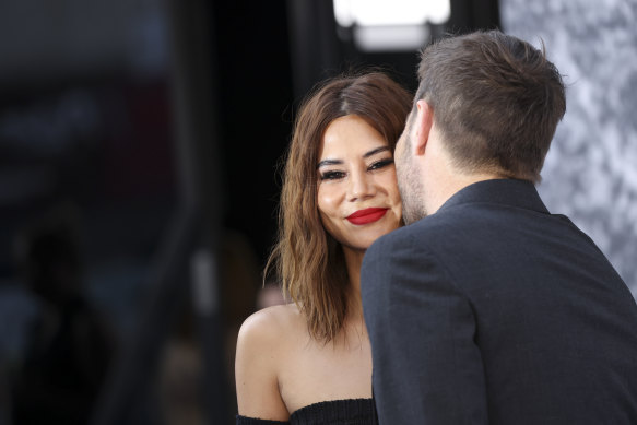 New Vogue Australia editor-in-chief Christine Centenera, left, and partner Joel Edgerton pose for photographers upon arrival for the screening of the film Thirteen Lives’in London, Monday, July 18, 2022. 