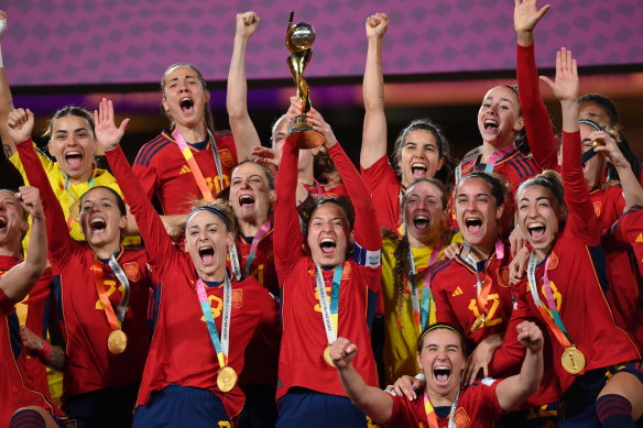 Spain lift the World Cup trophy. 