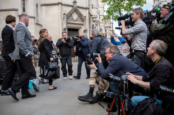 The media pack outside Court 13, where the biggest tabloid feud in Britain is laid bare. 