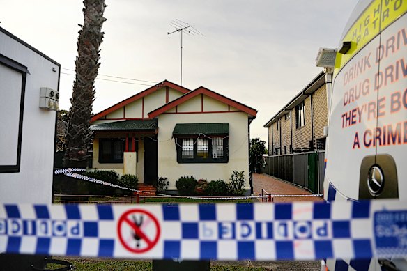 NSW forensic police process the crime scene on Kembla Street.