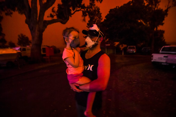 Mike and daughter Elsie wait for help getting out of fire-ravaged Mallacoota.