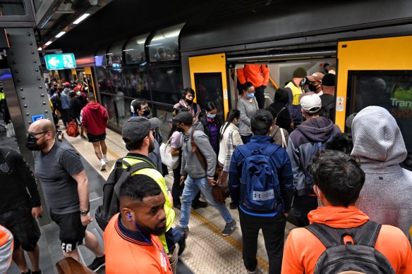 Commuters wait to board a train at Town Hall station last week during the industrial action.