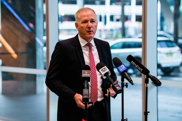 Police Commissioner Mick Fuller explaining his app idea at a press conference on Thursday. 