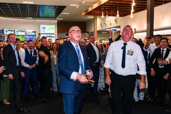 Dutton enjoys a game of two-up at the Townsville RSL on Friday. 