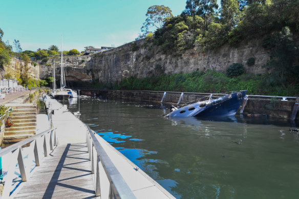 Curtain booms have been installed to contain floating debris and firefighting foam.