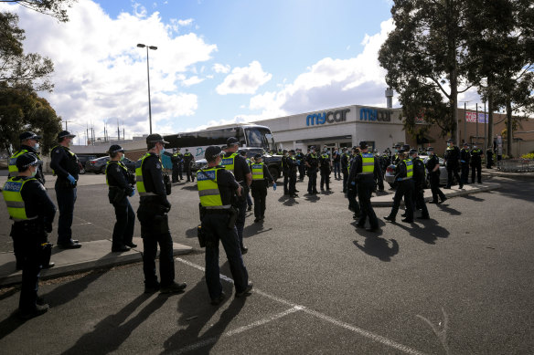 Police and riot squad search for protesters near Northcote Plaza and All Nations Park on Friday.