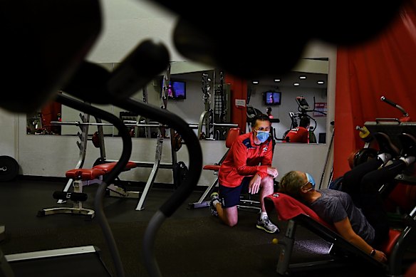 Joel Baur (left) the owner of Vision Personal Training Pyrmont with the morning’s first client training inside the studio.