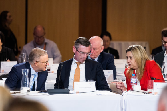 Prime Minister Anthony Albanese, NSW Premier Dominic Perrottet and Queensland Premier Annastatica Palaszczuk discuss policy ideas during the jobs summit.