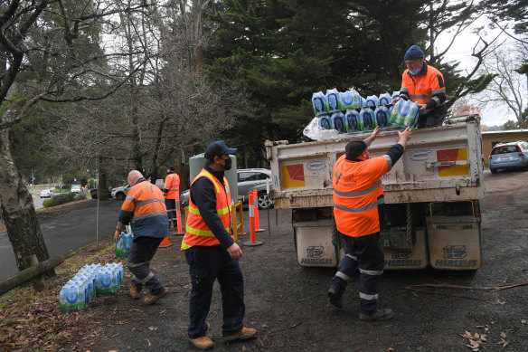Yarra Valley Water bring in drinking water tanks and bottles for Kallista residents on Wednesday.