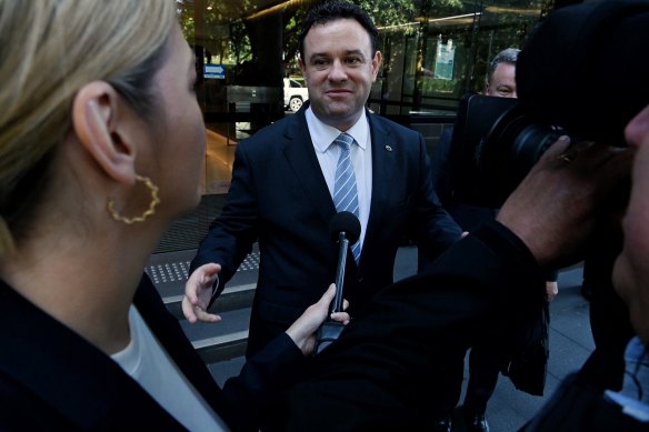 NSW Deputy Liberal Leader and Minister for jobs Stuart Ayres (centre) leaves the ICAC on Friday.