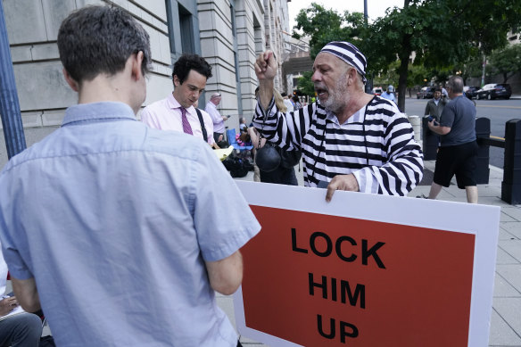 Protester Domenic Santana outside court in Washington the day before Trump is due to appear.