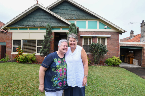 Sisters Norma Jackson-Snow and Heather Rutherford outside their family home. 