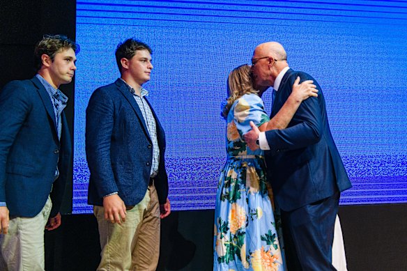 Peter Dutton embraces his wife and family at the Liberal campaign launch. 
