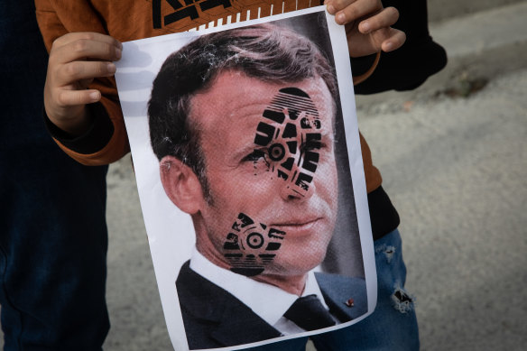 A poster of French President Emmanuel Macron marked with a shoe print at a protest in Turkey.