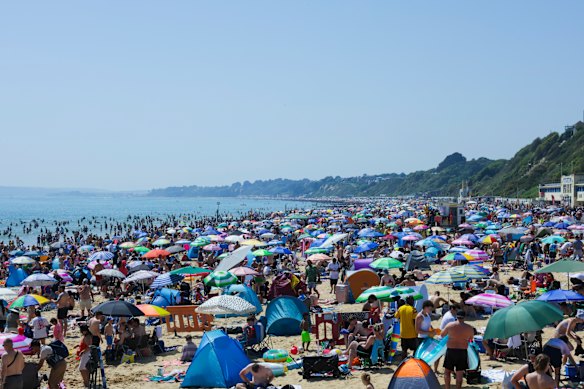 Sunbathers on Bournemouth Beach on Monday during an exceptional bank holiday long weekend in England.