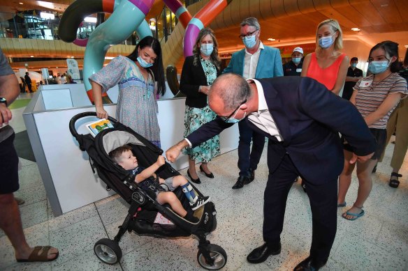 Acting Premier James Merlino greets two-year-old Malu Hunt at The Royal Children’s Hospital during the Good Friday Appeal.