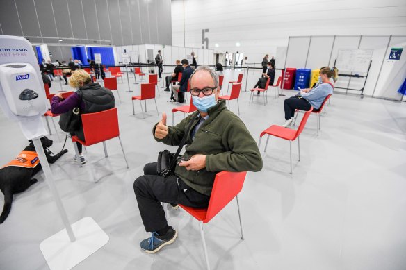 Leigh Henningham gives the thumb’s up at the mass vaccination site at the Melbourne Convention and Exhibition Centre.