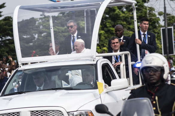 Pope Francis greets well-wishers after arriving in Kinshasa, Congo.