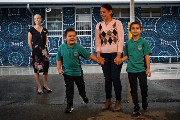 Tagiilima Tretiak with sons Alexander and Leonardo, and relieving assistant principal Rebecca Haeren (left) at Warwick Farm Public School. 