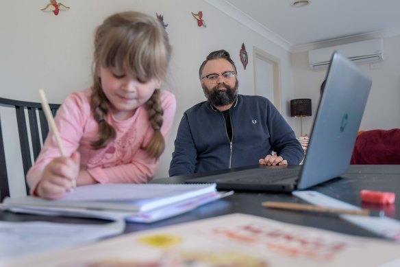 Disability worker David Wragg, at home with his daughter Elissa, has serious misgivings about the quality of her remote education. 