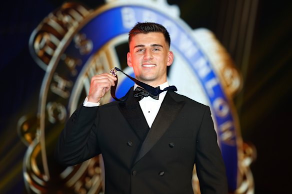 Daicos proudly shows off the 2026 Brownlow Medal after a record-breaking night.