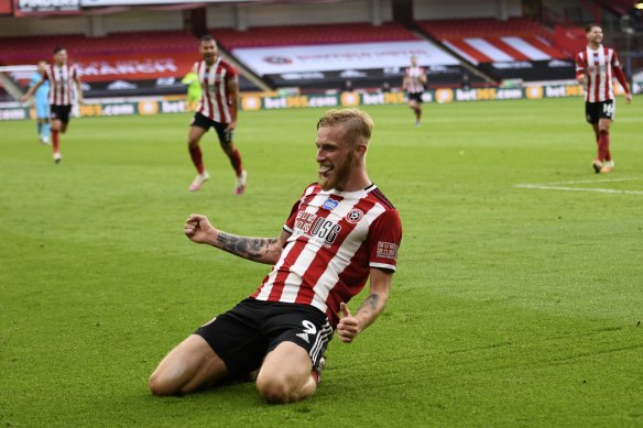 Sheffield United's Oliver McBurnie celebrates scoring the third goal of the Blades' 3-1 Premier League win over Tottenham.