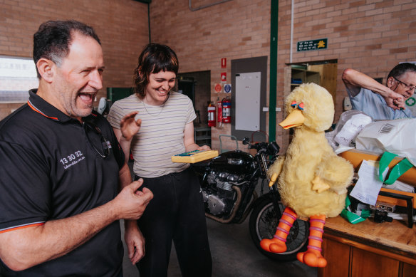 John Theore asked electrical repair technician Othy Willis to fix Big Bird, his children’s toy, at the Bower Reuse and Repair Centre in Summer Hill. 