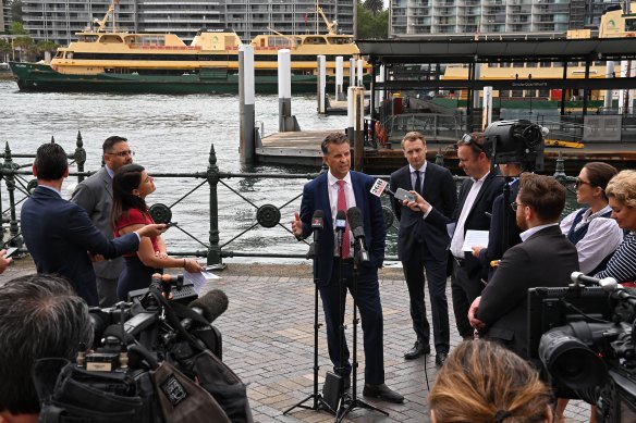 Transport Minister Andrew Constance confirms the retirement of three of the Freshwater ferries as one of them sails from Circular Quay.