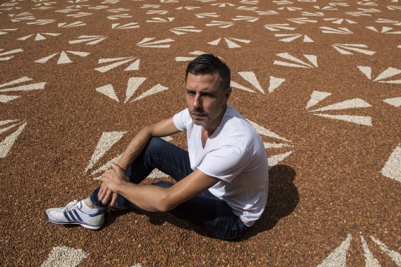 Artist Jonathan Jones with his emu print work on display at Hyde Park Barracks.