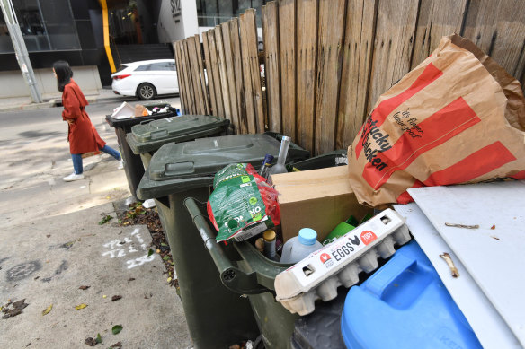 Overflowing rubbish bins in South Yarra on Tuesday. Waste levels have surged during the COVID-19 lockdown.